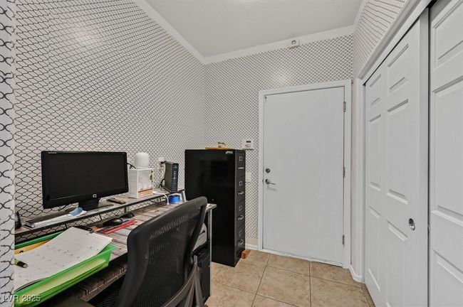 Home office featuring crown molding and light tile patterned floors | Image 18