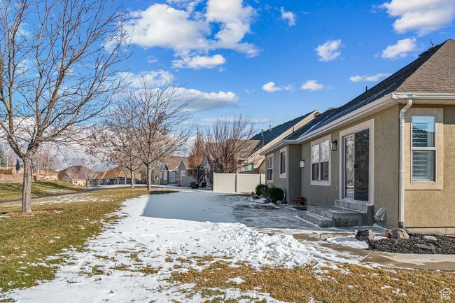 View of yard covered in snow, and trail | Image 39