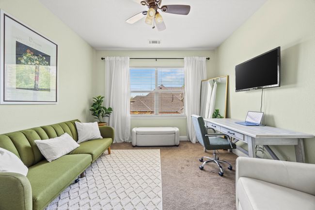Bedroom upstairs with ensuite full bath, currently being used as an office. | Image 29
