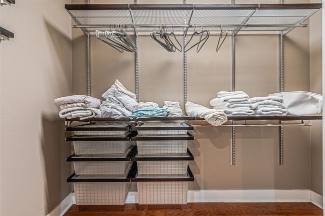 Walk in closet featuring wood finished floors | Image 24