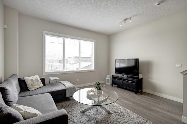 107 - 2802 Kings Heights Gate Se, Home with 3 bedrooms, 2 bathrooms and 2 parking in Airdrie AB | Image 5