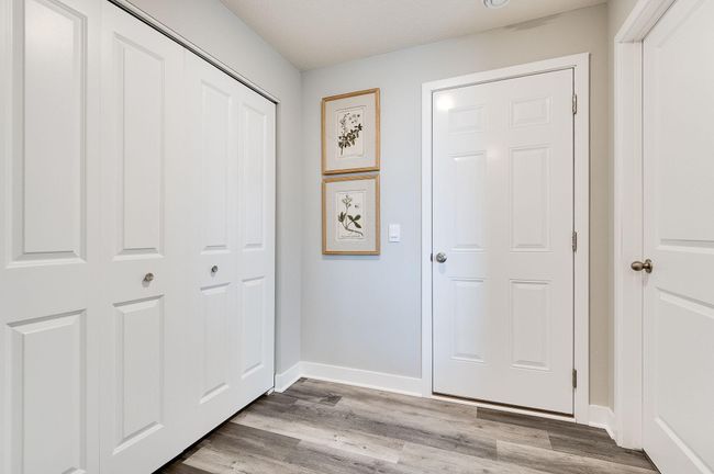 Enormous mudroom area with walk in closet, bifold closet, and the 1/2 bath. Previously built model home, finishes, selections, and colors to vary from future built home. | Image 18
