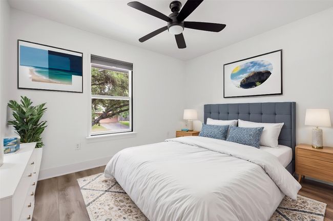Bedroom featuring baseboards, a ceiling fan, and wood finished floors | Image 24