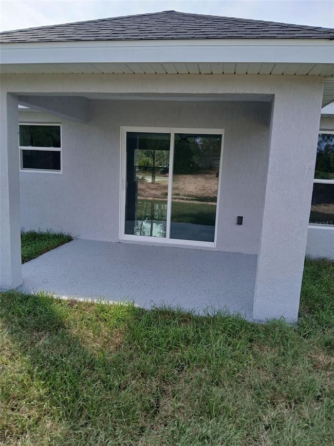 covered back porch, with epoxy floor finish | Image 35