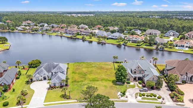 Aerial view of residential area with a nearby body of water | Image 6