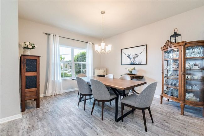 Elegant dining room with chandelier lighting | Image 6