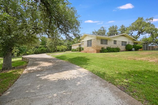 Circular paved driveway and parking. | Image 4