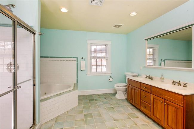 Primary bath with tub, shower and double vanity. | Image 13