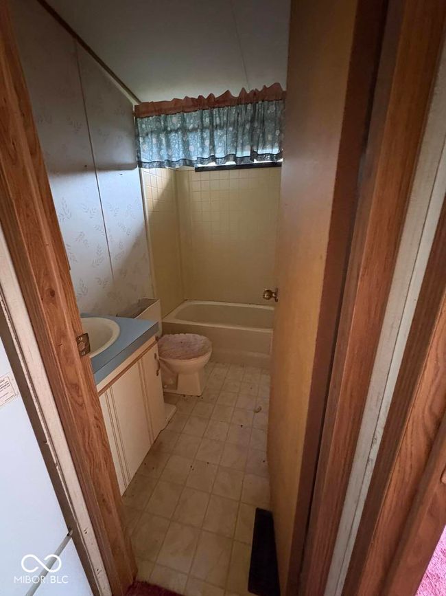 full bathroom with vanity and a tub | Image 18