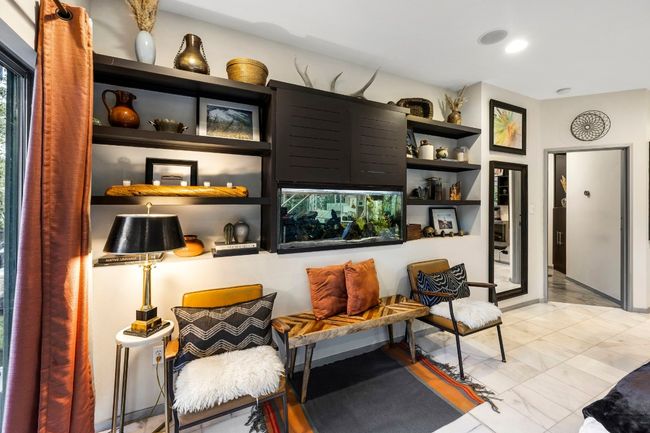 Built in book shelf and aqarium in Primary Suite on the first level | Image 29