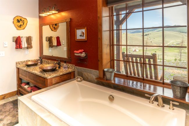 Full bath with a garden tub, double vanity, and baseboards | Image 46