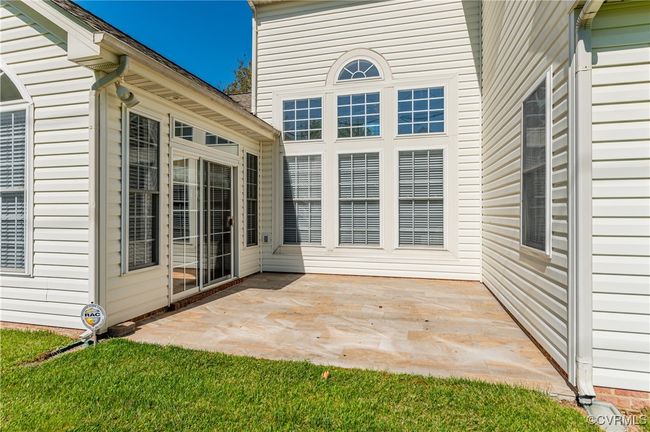 This tiled patio is a lovely spot to catch some rays and sip your morning brew! | Image 40