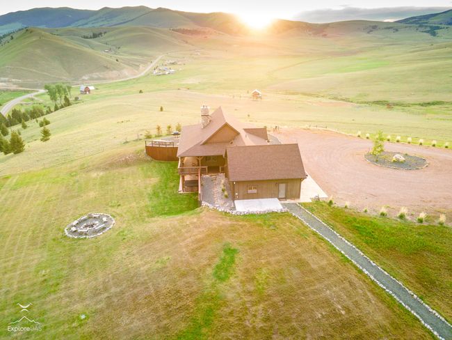 Aerial view of sparsely populated area featuring a mountain backdrop | Image 36