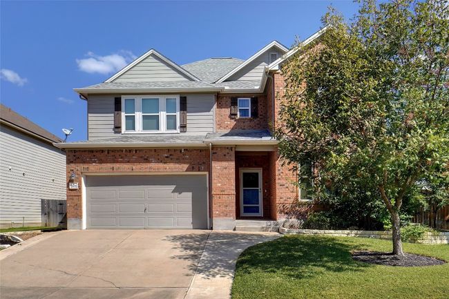 Front of home. Beautifully landscaped with mature trees. | Image 5