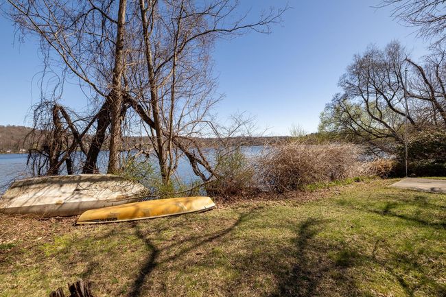 View of yard with a water view | Image 7