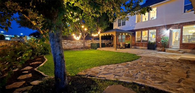 Yard at twilight featuring a patio and a fenced backyard | Image 33