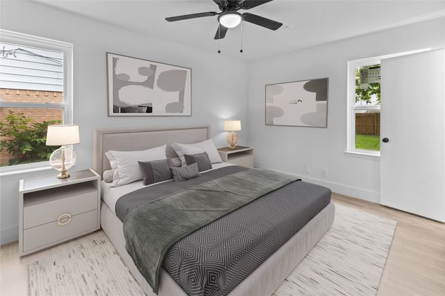 Bedroom featuring wood finished floors and ceiling fan | Image 16