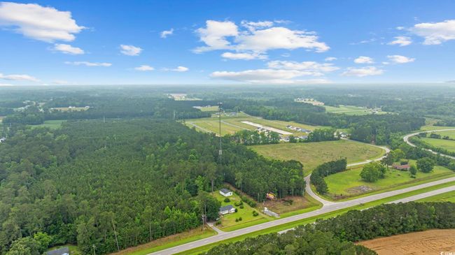 Overview of rural landscape featuring a heavily wooded area | Image 8