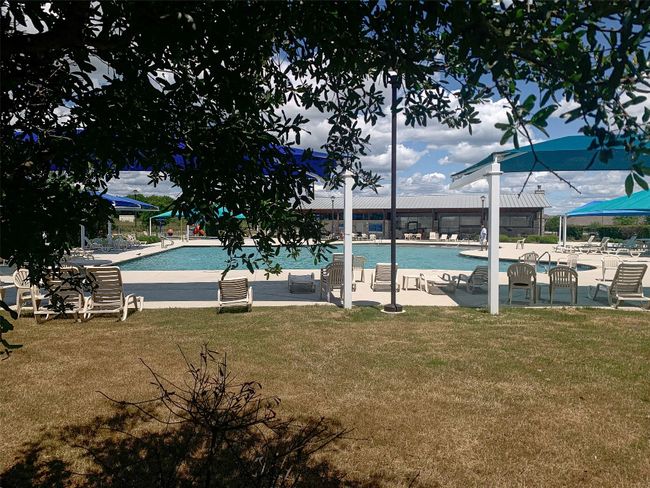 Community pool featuring a yard and a patio area | Image 34