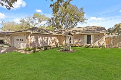 This captivating home boasts a curbside appeal and arrival experience, highlighted by a beautiful brick elevation. | Image 3