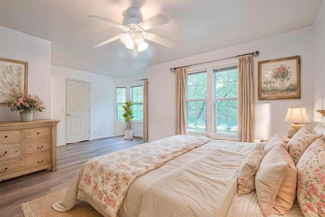 Primary retreat virtually staged. What a way to wake up in the morning to those trees! | Image 21