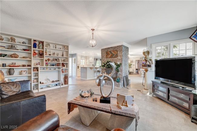 Living room with a chandelier | Image 37