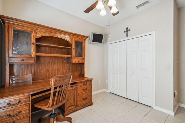 THIRD BEDROOM DEPICTED AS A DEN | Image 49