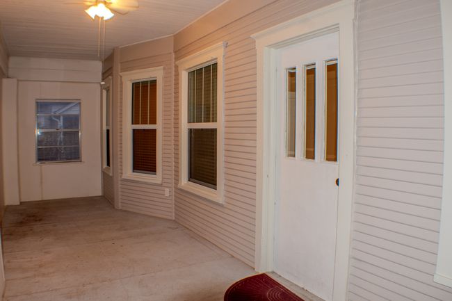 Front enclosed porch but could be opened up to display the beautiful front of home design. | Image 11