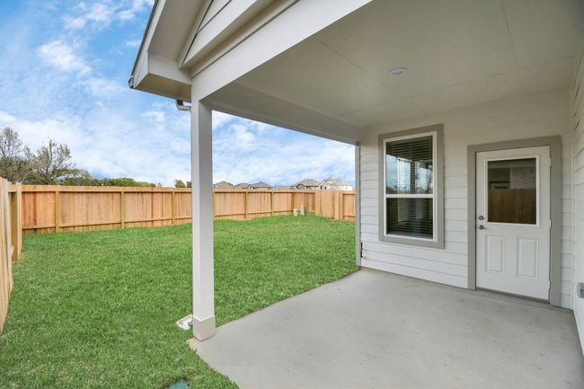 Come and see this spacious backyard with its beautiful covered patio. There is plenty of room for the kids to play and adults to relax. Perfect for your outdoor living space, patio furniture, bbq pit, and so much more. The possibilities are endless! | Image 37