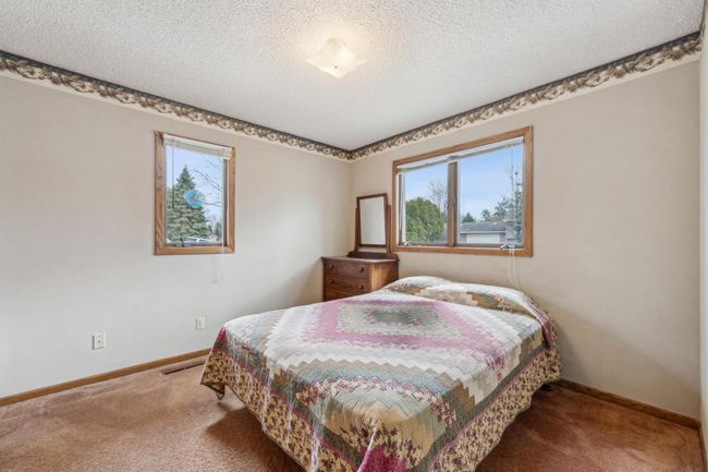 2nd main level bedroom with ample natural light | Image 12