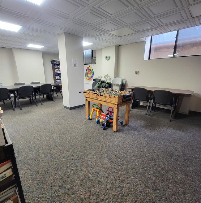 Recreation room with carpet, an ornate ceiling, and baseboards | Image 17