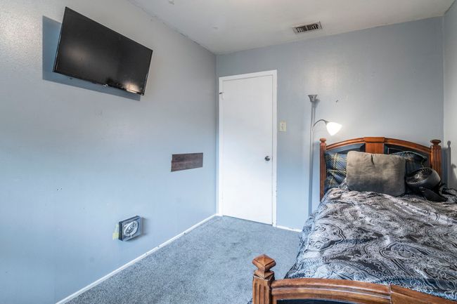 Carpeted bedroom with baseboards | Image 19
