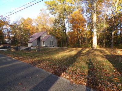 View from the other side of the wide lot. Home is on a cul-de-sac and backs up to the woods. | Image 3