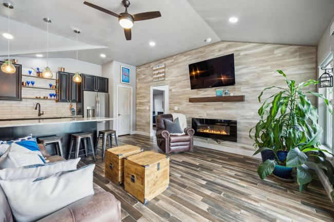 Living Room in Second Dwelling with Built-in Electric Fireplace and Vinyl Plank | Image 30