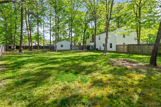 View of yard with a fenced backyard | Image 25
