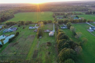 Aerial view at dusk with a water view and a rural view | Image 2