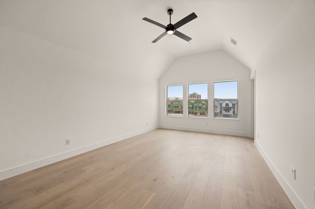 This wonderful light filled owner's suite features dramatic ceilings paired beautiful flooring to create a peaceful and relaxing space. | Image 19