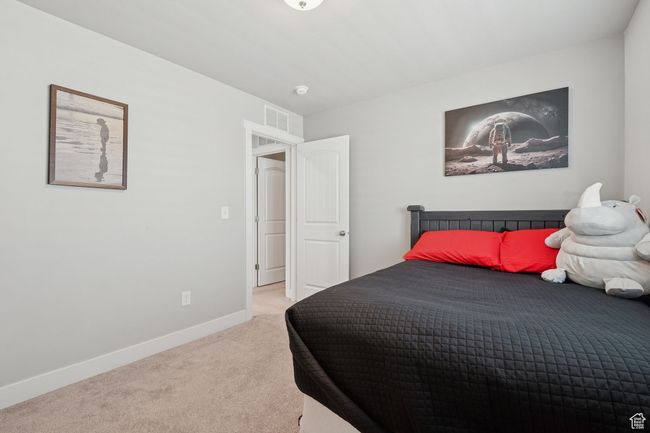 Bedroom with carpet and baseboards | Image 23