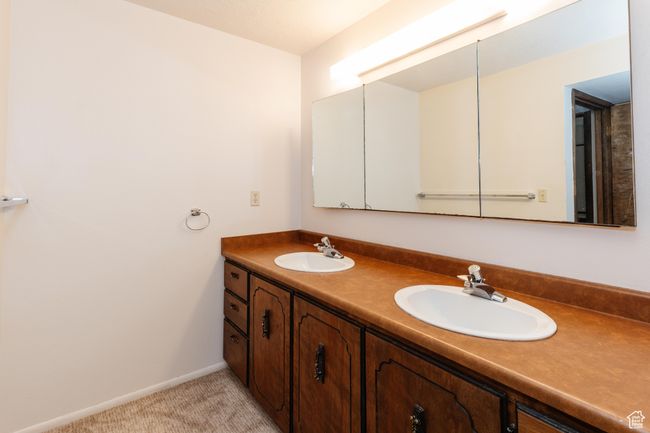 Full bath with double vanity and baseboards | Image 28