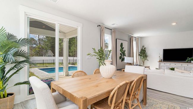 Dining space featuring light wood finished floors | Image 8