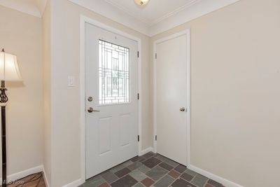 Slate tile floor and coat closet. | Image 2