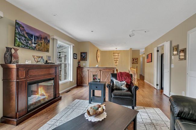 Catwalk style hallway to the bedrooms gives this home a "two story" feel | Image 11