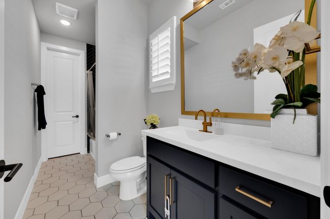 Full bath featuring vanity, tile patterned flooring, and shower / tub combo with curtain | Image 27