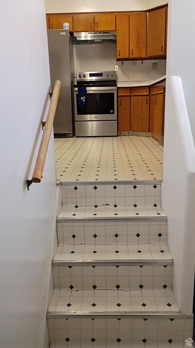 Stairs leading into the kitchen | Image 24