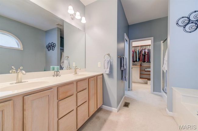 ...a double-sink vanity, and a luxurious soaking tub. | Image 20