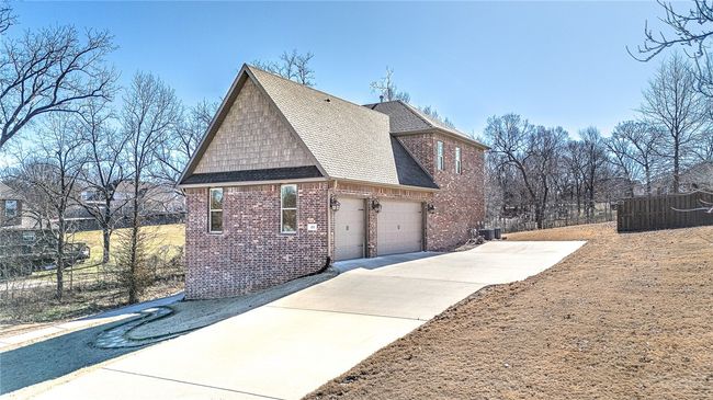 Not only triple garage, but tall, finished out, heated and cooled garage too. | Image 35