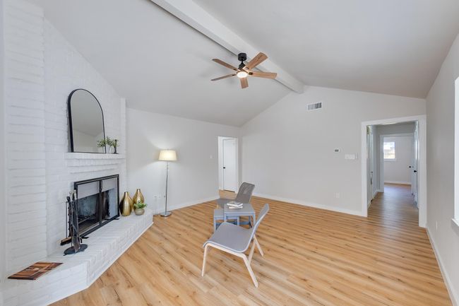 Family room with chimney and high ceiling | Image 4