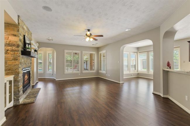 Updated roof, remodeled baths, 6 car garage, updated flooring and paint, custom built fireplace and built-ins and more! | Image 12