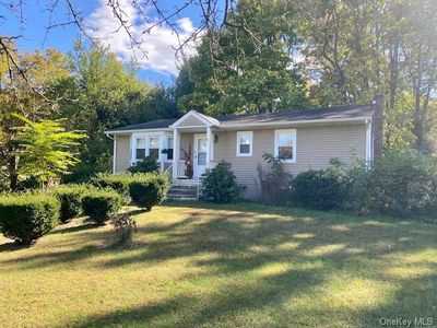 View of home's exterior with a lawn | Image 2