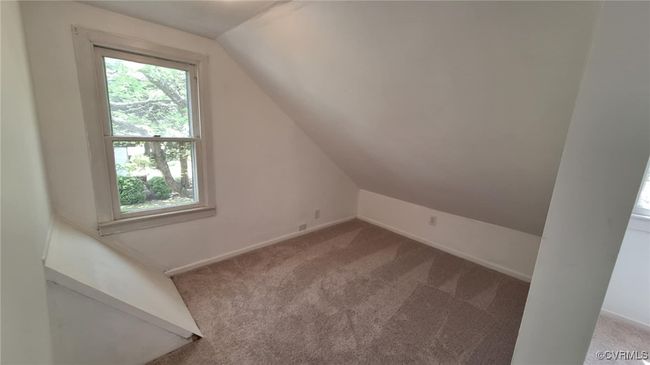 Additional living space with carpet, baseboards, and lofted ceiling | Image 38